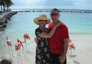 Dr. Robyn with her husband, Jason in Aruba on flamingo beach